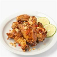 Viet Style Chicken Wings · Seasoned chicken wings glazed with our Viet style sauce
