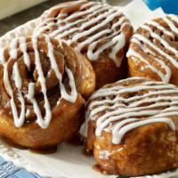 Hot Cinnamon Roll · A sweet and gooey treat with swirls of cinnamon. Topped with creamy icing and served warm.