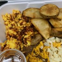 Chorizo And Eggs · scrambled eggs and chorizo, refried beans fresh sliced potatoes and choice of corn or flour ...