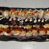 Nemo Roll · Raw. Hot and spicy. No rice. Albacore tuna, red tuna, crab mix, avocado, soy wrap, topped wi...