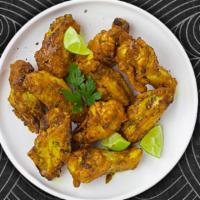 John Lemon Pepper Wings · Fresh chicken wings fried until golden brown, and tossed in lemon pepper sauce. Served with ...