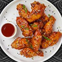 Sweet & Sour Paradox Wings · Fresh chicken wings fried until golden brown, and tossed in sweet and sour sauce. Served wit...