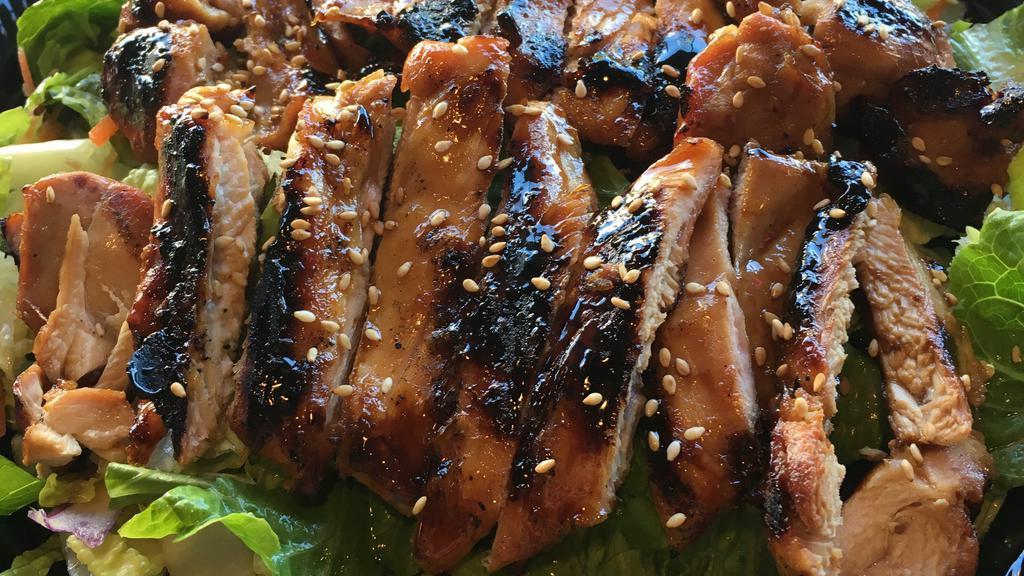 Grilled Chicken Salad · Tender slices grilled of grilled teriyaki chicken served over a bed of romaine salad with our tangy house sesame vinaigrette and sprinkled with sesame seeds.
