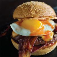 Chef'S Favorite Burger · Cheese two ways, bacon, ketchup leather, sunny fried egg, hot sauce. Regular Fries included