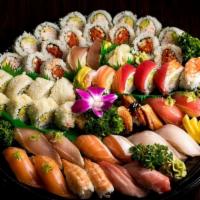 Party Platter B · Assorted Sushi (16 pieces), California Roll (8 pieces), Spicy Tuna Roll (8 pieces), Rainbow ...