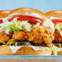 C-1. Crispy Chicken Burger · Fried chicken Burger with a crispy chicken patty. With sliced tomato, fried onion chips, let...