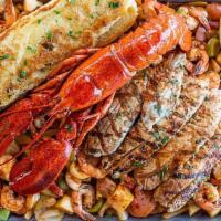 Super Tray · Grilled shrimp, whole lobster, whitefish fillet, and SPFM Veggie Mix seared “A la Plancha” s...