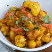 Aloo Gobi · Potato and cauliflower in tomato and ground spices.