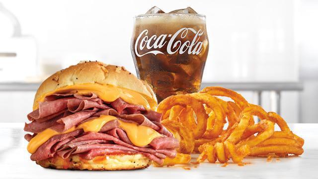 Double Beef 'N Cheddar Meal · Two times the amount of thinly sliced roast beef than the Classic, with warm cheddar sauce and zesty red ranch sauce on a toasted onion roll. Visit arbys.com for nutritional and allergen information.