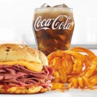 Classic Beef 'N Cheddar Meal · Thinly sliced roast beef with warm cheddar sauce and zesty red ranch sauce on a toasted onio...
