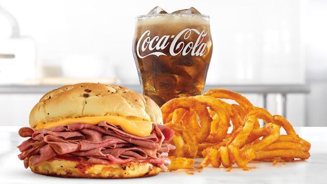 Classic Beef 'N Cheddar Meal · Thinly sliced roast beef with warm cheddar sauce and zesty red ranch sauce on a toasted onion roll. Visit arbys.com for nutritional and allergen information.