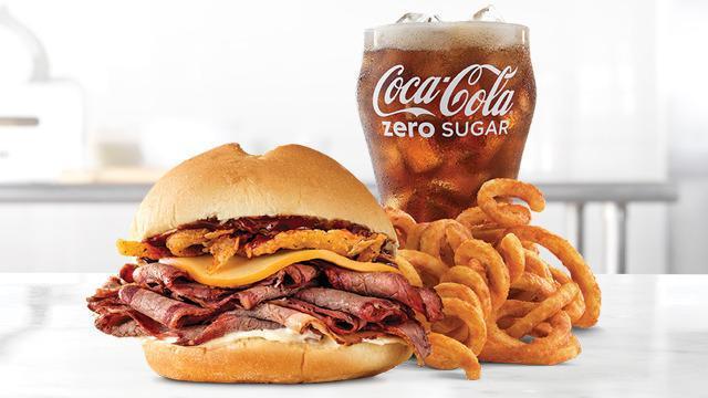 Smokehouse Brisket Meal · Sliced smoked brisket with melted Gouda cheese, crispy onions, smoky BBQ sauce and mayonnaise on a toasted specialty roll. Visit arbys.com for nutritional and allergen information.