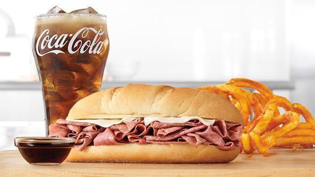 French Dip & Swiss Classic With Au Jus Meal · Thinly sliced roast beef with melted Swiss cheese on a toasted sub roll. Served with au jus for dipping. Meal includes choice of side and drink.