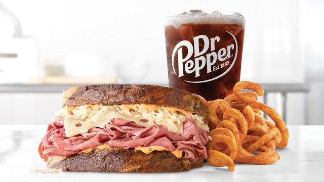 Reuben Meal · Thinly sliced corned beef with melted Swiss cheese, tangy sauerkraut and creamy Thousand Island dressing on toasted marble rye bread. Meal includes choice of side and drink.