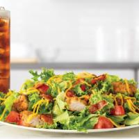 Crispy Chicken Farmhouse Salad Meal · Crispy chicken and diced pepper bacon on a bed of chopped fresh lettuce with diced tomatoes ...