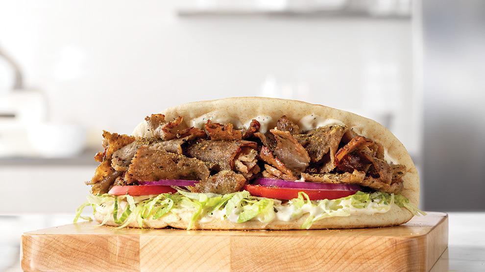 Traditional Greek Gyro · A blend of beef, lamb and Mediterranean spices sliced from a spit rotisserie and placed on a warm flatbread with lettuce, tomatoes, red onions, tzatziki sauce and Greek seasoning. Visit arbys.com for nutritional and allergen information.