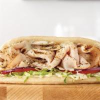 Turkey Gyro · Our Turkey Gyro is crafted with our classic thinly sliced roast turkey, lettuce, onions and ...