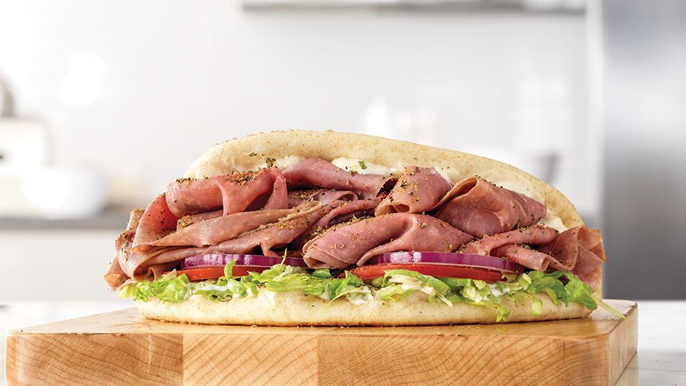 Roast Beef Gyro · Thinly sliced roast beef with Greek Seasonings, cool creamy tzatziki sauce, lettuce, tomato and red onion in a warm pita. Visit arbys.com for nutritional and allergen information.