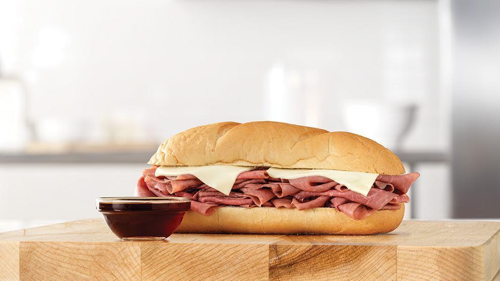 French Dip & Swiss Classic With Au Jus · Thinly sliced roast beef with melted Swiss cheese on a toasted sub roll. Served with au jus for dipping. Visit arbys.com for nutritional and allergen information.