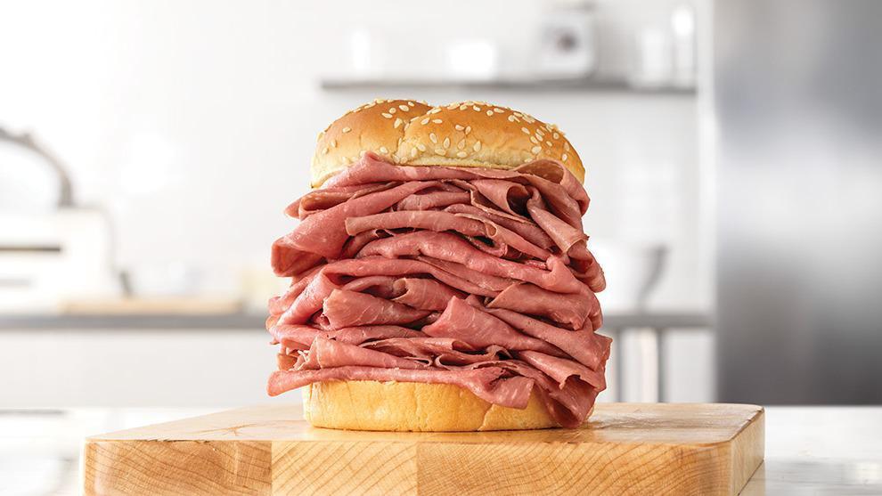 Roast Beef Half Pound · A half pound of thinly sliced roast beef on a toasted sesame seed bun. Visit arbys.com for nutritional and allergen information.