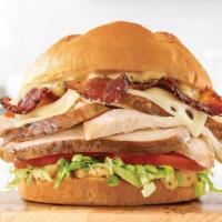 Roast Chicken Bacon & Swiss · Slow roasted chicken with pepper bacon, Swiss cheese, lettuce, tomato and honey mustard on a...