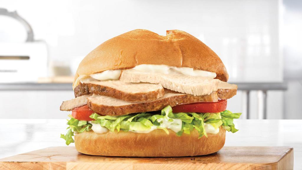 Roast Classic Chicken · If you’re craving juicy, slow-roasted chicken topped with tomato, lettuce, mayo, and star top buns…  so is everyone else. Now would be a good time to hurry to Arby’s.