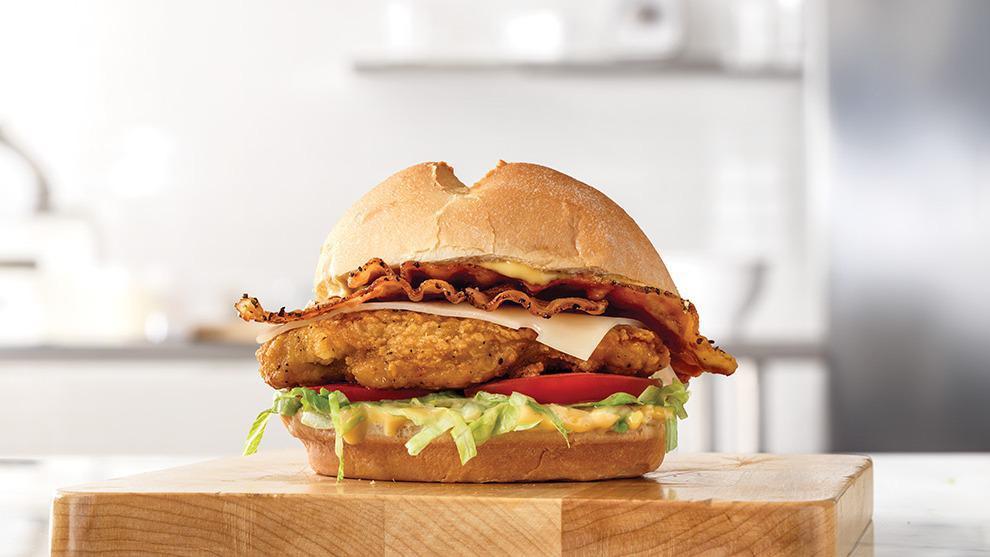 Buttermilk Chicken Bacon 'N Swiss · A crispy buttermilk chicken fillet with thick-cut pepper bacon, melted Swiss cheese, lettuce, tomato and honey mustard on a toasted star top bun.
