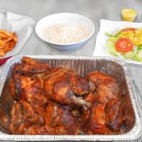 The Family Value Pack · Two whole chickens with your choice of three large side orders and four dipping sauces.