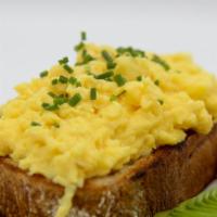 Eggs On Toast · Soft scrambled on crispy buttered sourdough toast! Add ham + avocado if you'd like.