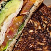 California Club · Turkey, bacon, avocado, lettuce, tomato, “wake-up“ sauce, and mayo on griddled sandwich bread.