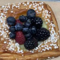 Mixed Berry Danish · Croissant dough with pastry cream in the middle and a mix of berries on top.<br />