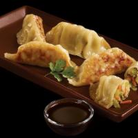 A5: Dumplings Potstickers · 6 pieces pan fried potstickers