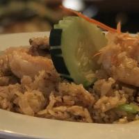 Pineapple Fried Rice · Wok fried with shrimp, chicken, raisin, pineapple, cashew nut, snow pea, and touch of curry ...
