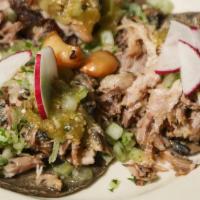 Signature Carnitas Taco · Our signature taco.  One Michoacan style pork carnitas taco slow cooked for over four hours....