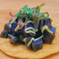 Purple Potato Taco (Vegan) · Purple potatoes roasted in coconut oil, garlic, rosemary, sea salt and black pepper served o...
