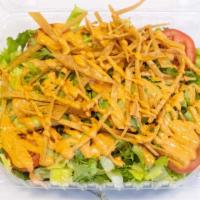 Chipotle Salad · Romaine lettuce, avocado slices, tomato, cilantro, chipotle dressing and tortilla strips.