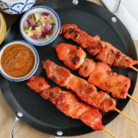 Chicken Sate (4) · Tender marinated chicken, grilled on skewers complemented with peanut sauce and cucumber sau...