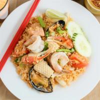 Seafood Fried Rice · Stir-fried jasmine rice with seafood, egg, tomatoes, onion.