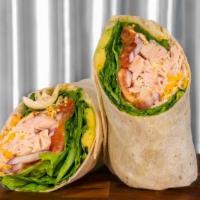 Turkey Wrap · Thinly sliced turkey breast wrapped with fresh tomato, onion and lettuce. Topped with shredd...