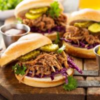 Torta Ahogada · Mouthwatering sandwich made with sourdough bread, and topped with pork carnitas, marinated o...