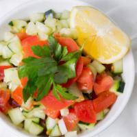 Israeli-Shirazi Salad · Cucumber, tomatoes, onion, lemon juice and olive oil.