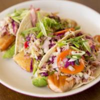 Salmon Belly Tacos · Gluten free. 3 pieces. With avocado, cabbage jalapeno slaw, green onion, and sriracha aioli.