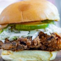 Fried Chicken Sandwich · Served with housemade slaw, pickles and onions on a potato bun.