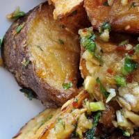 Fried Potatoes · With mint, cilantro, chili, garlic vinaigrette, and fish sauce.