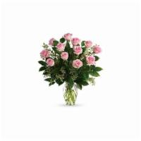 Dozen Pink Roses · Soft as a whisper, this pretty bouquet of a dozen sweet pink roses and deep greens are simpl...