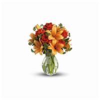 Rose And Lily Fall Bouquet · Ignite their heart with this inspirational gift of warm orange roses and lilies. As wondrous...