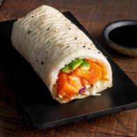 Salmon Sushirrito · Salmon, Yuzu Coleslaw, Cucumber, Sesame Seeds, Sushi Rice and Miso Vinegar Wrapped in Soy Pa...