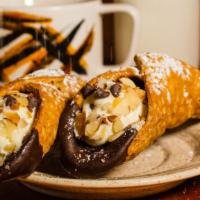 Cannoli · Italian dessert made from a light crunchy dough, stuffed with ricotta cheese and chocolate c...