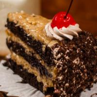 German Chocolate Slice · Chocolate cake stuffed with grated coconut and walnut, decorated with chocolate, coconut, an...