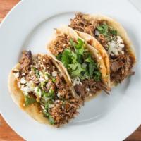 Tacos Del Barrio (3 Per Order) · 3 taco platter, choice of meats, onion, cilantro, salsa, cheese, on corn tortillas or flour ...